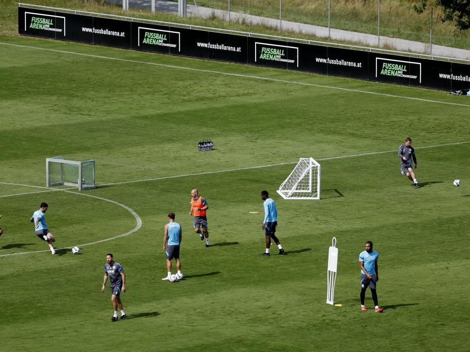 A general view of training from a vantage point with the pitch at the bottom of the hills