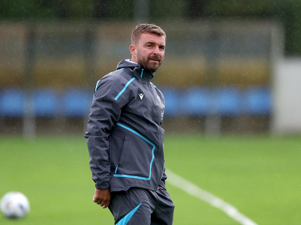 James Morrison smiling during a training session in the rain