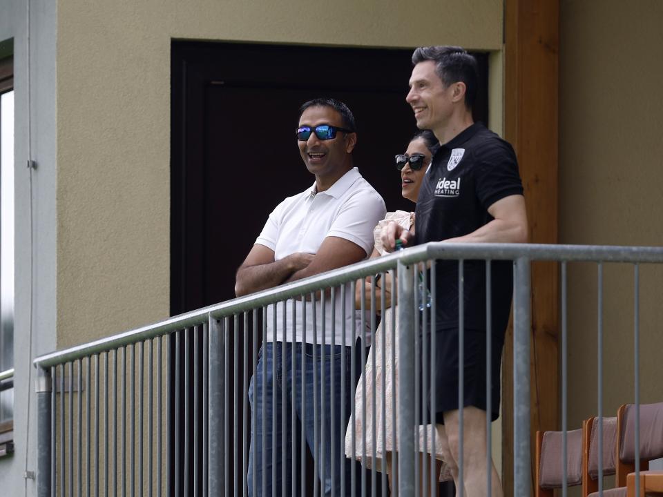 Shilen Patel and Andrew Nestor smiling while watching Albion play Dynamo Kyiv