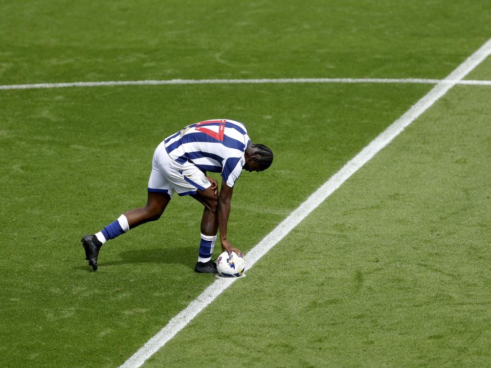 Ousmane Diakité placing the ball on the centre circle after scoring at Blackpool