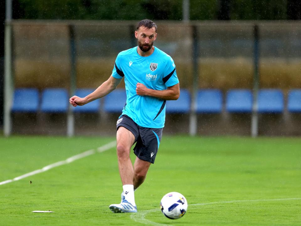 Nat Phillips on the ball during a training session in the rain