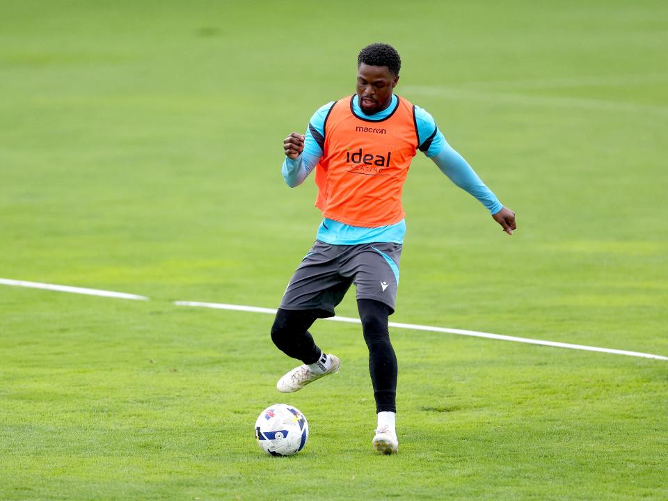 Josh Maja on the ball during a training session in the rain