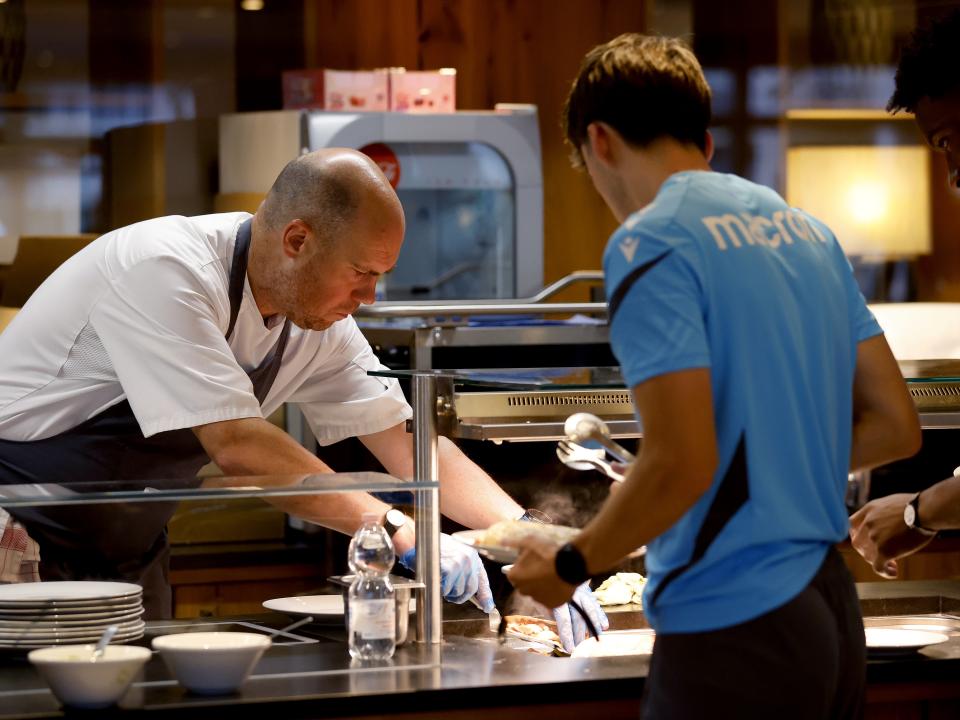 A WBA chef preparing food for a player at the hotel