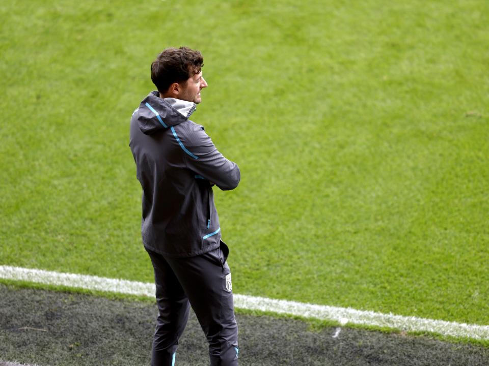 Ryan Mason watching Blackpool v WBA from the dugout 