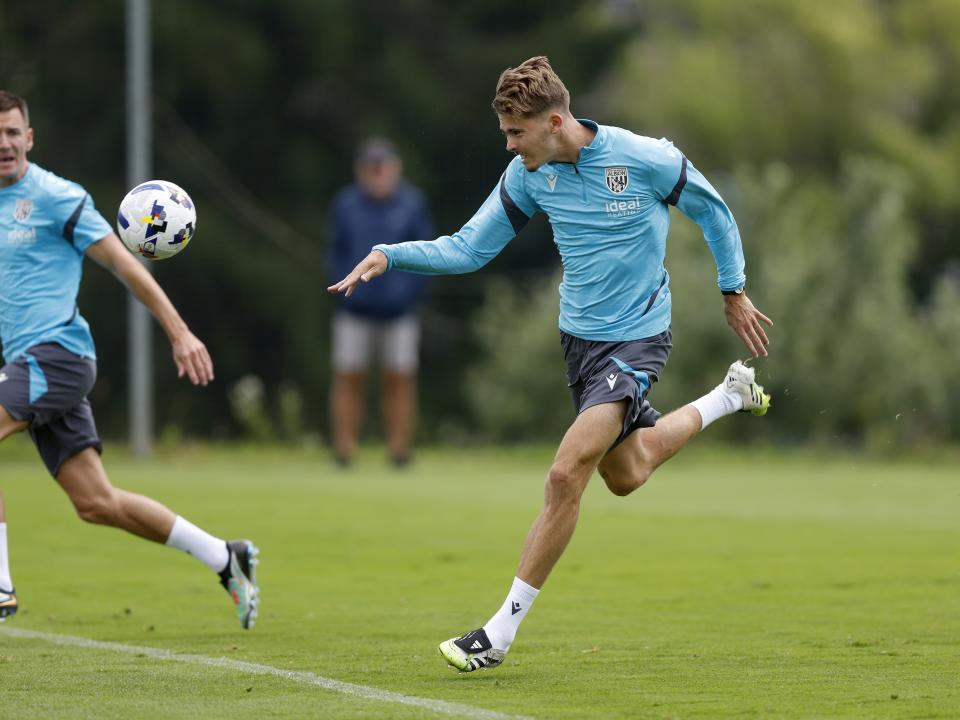 Isaac Price heading the ball during training