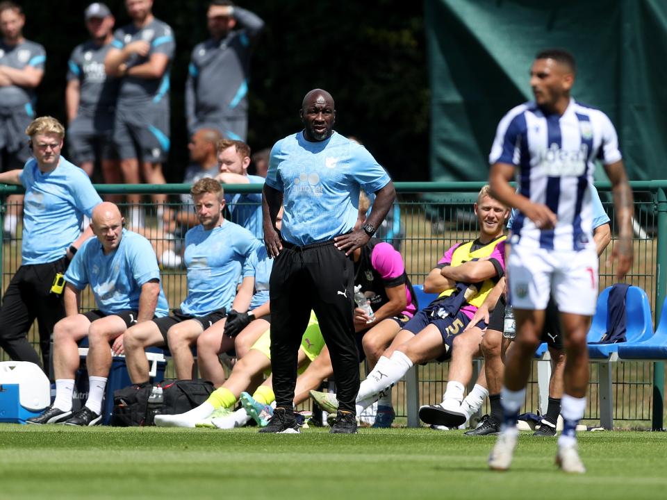 Port Vale boss Darren Moore watching WBA v Port Vale