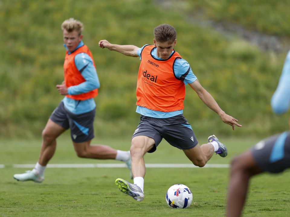 Tom Fellows striking the ball during training