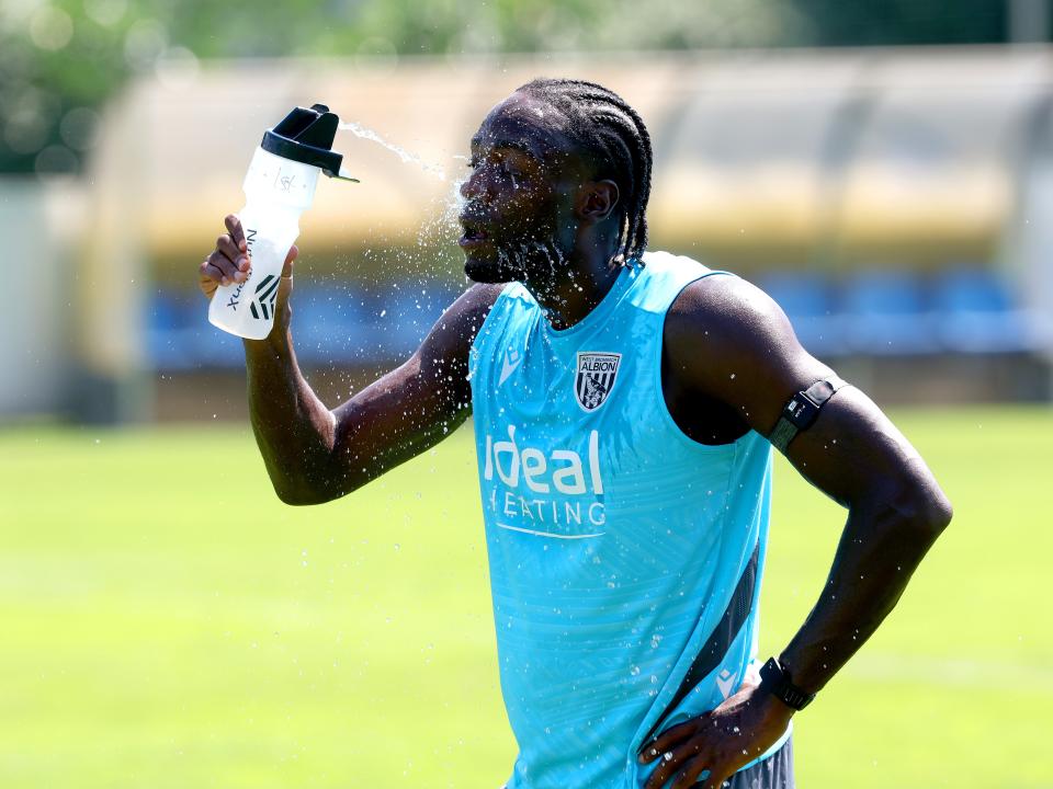 Devante Cole squirting water in his face