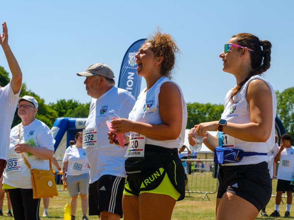 Group of participants shouting with joy in the warm up area