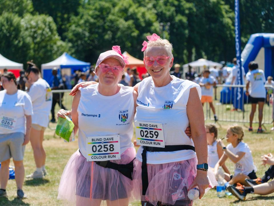 Two participants in pink girls and tutu