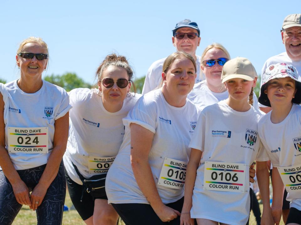 Family of participants smiling for the photo.