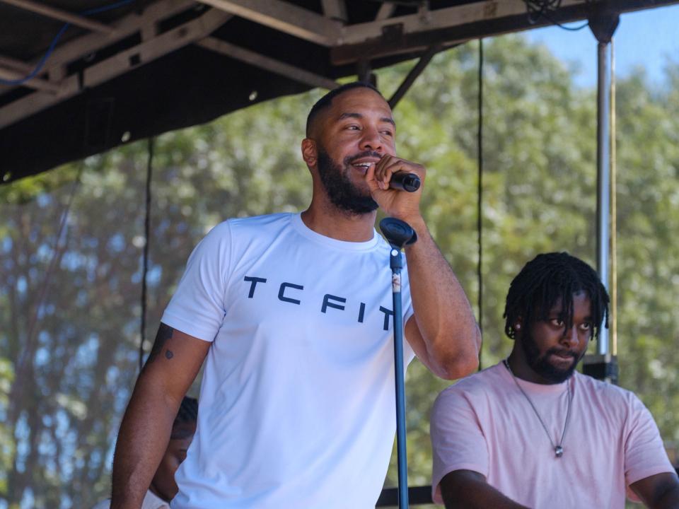 TC Fit Tony speaking on the mic during the warm-up