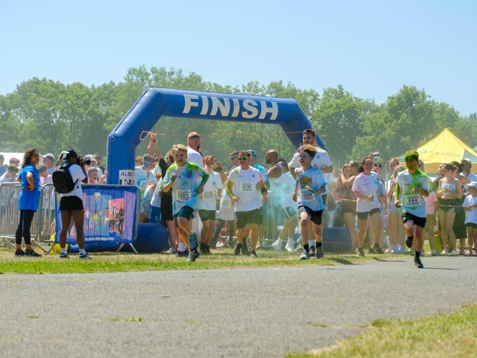 First wave of runners leaving the start line.