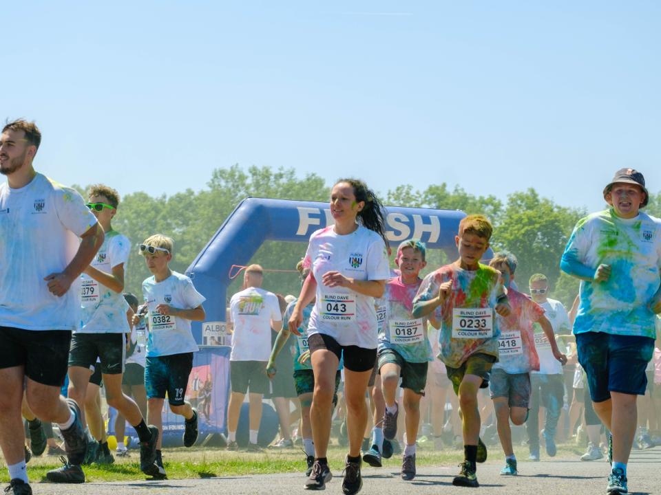 First wave of runners leaving the start line.