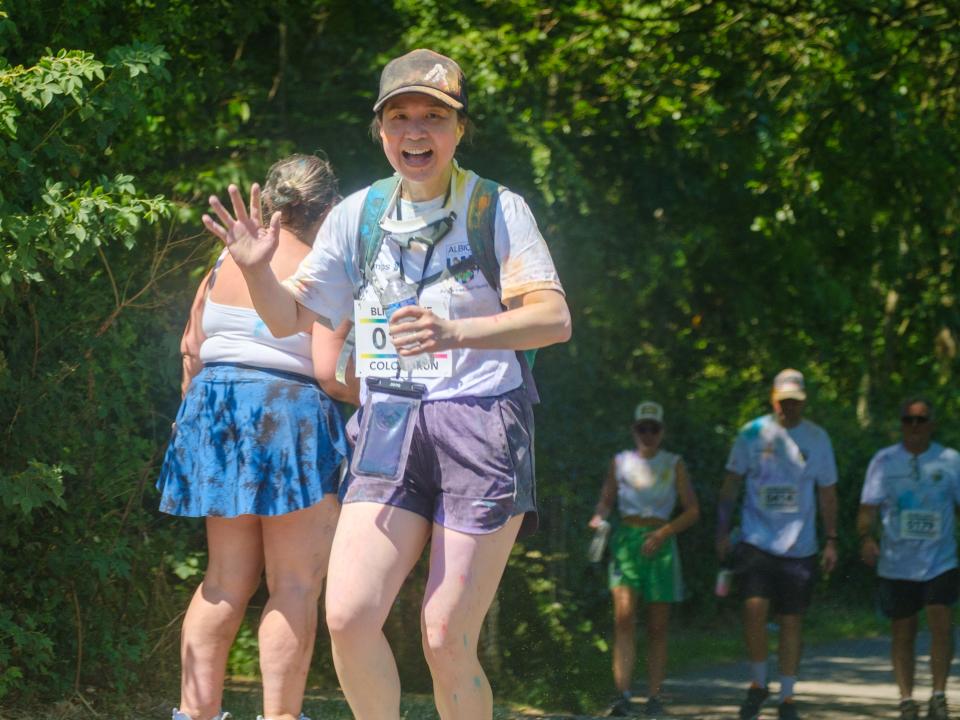 Mother waving to the camera.