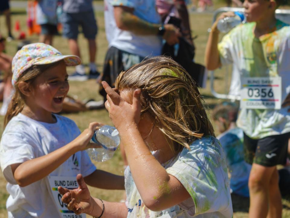Closing up of young participant, after running water over hair.