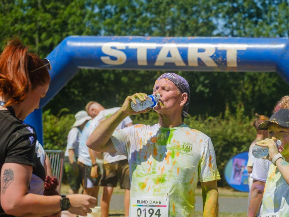 Blind Dave drinking a well deserved bottle of water.