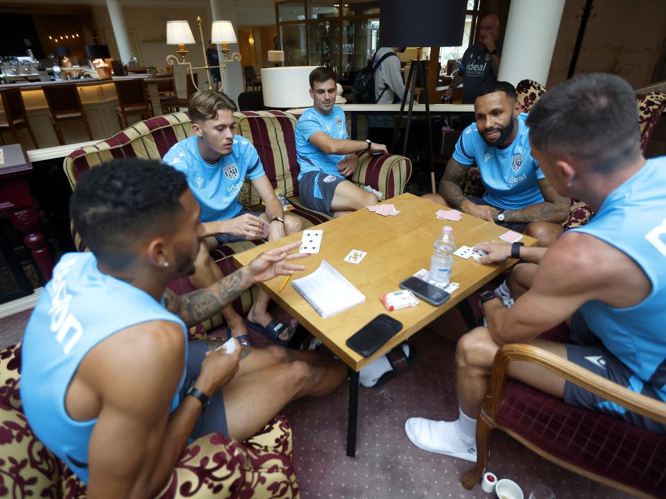several WBA players sat round a table in Austria playing cards