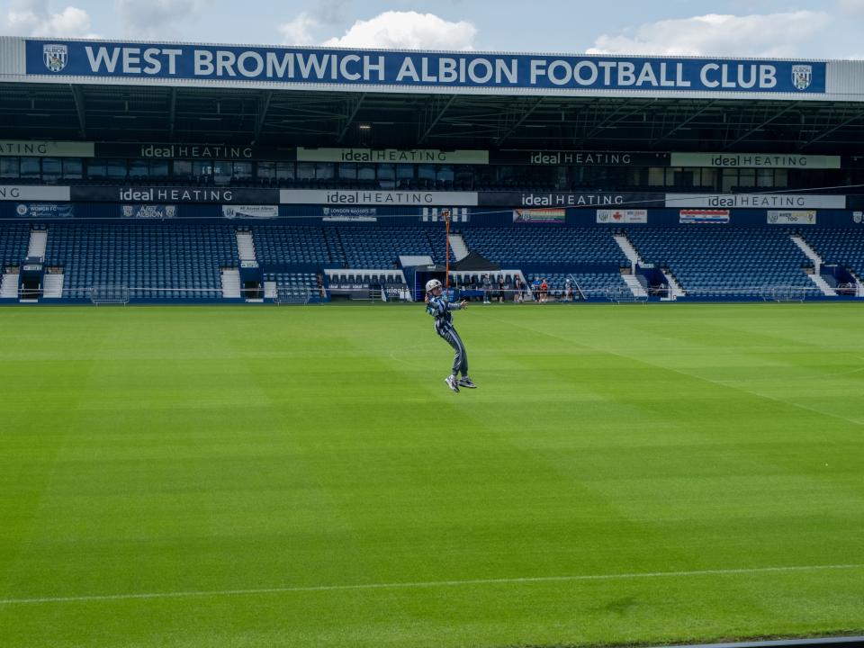 A participant zip wires across The Hawthorns.