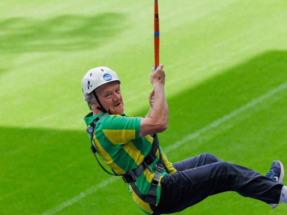 A participant zip wires across The Hawthorns.