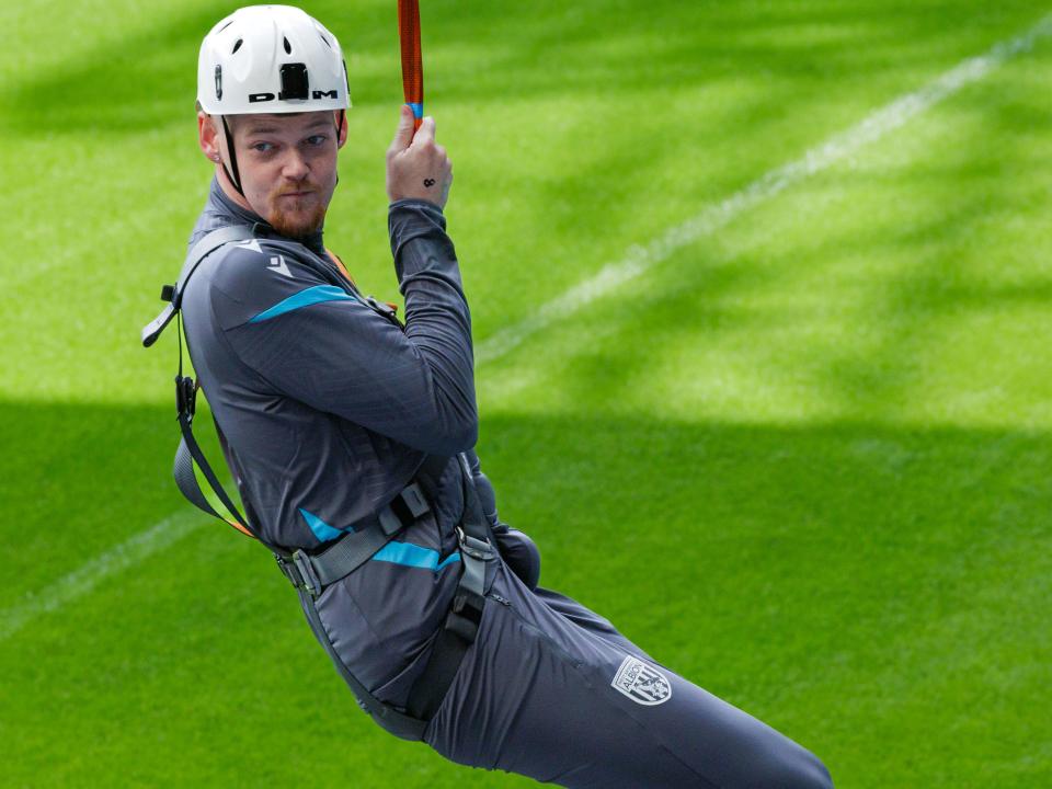 A participant zip wires across The Hawthorns.