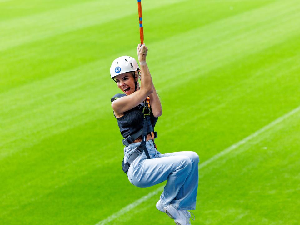 A participant zip wires across The Hawthorns.