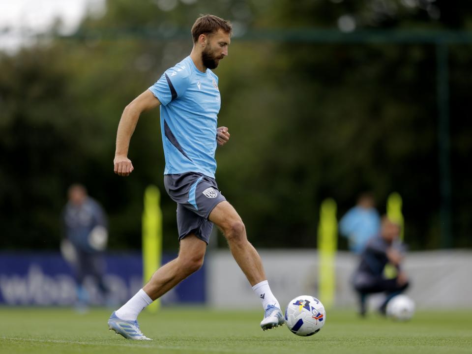 Nat Phillips passing the ball during training 