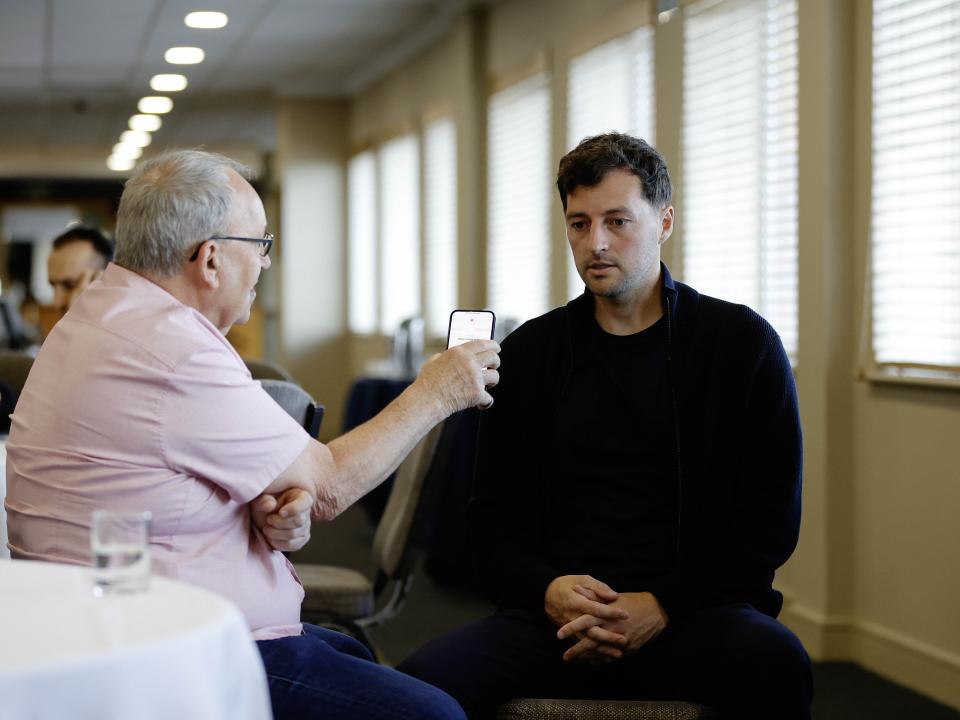 Ryan Mason talking to a radio reporter 