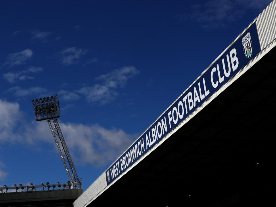 An image of the West Stand at The Hawthorns, and a floodlight