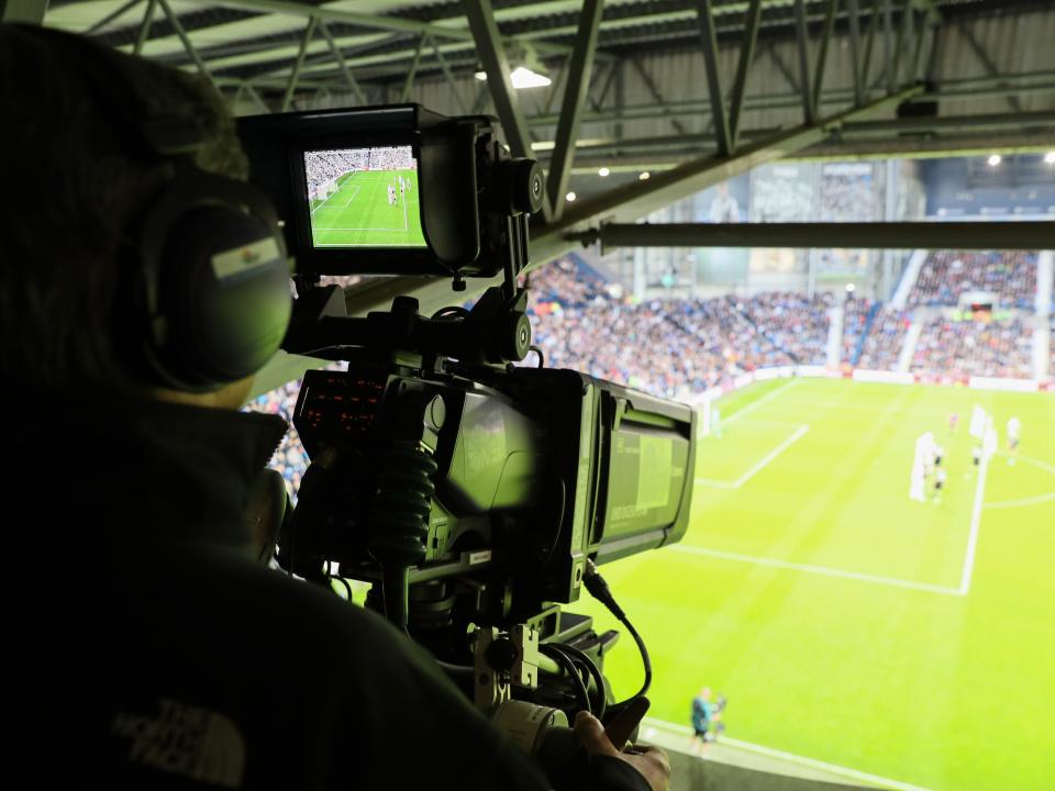 A broadcast camera filming a match at The Hawthorns from the gantry 