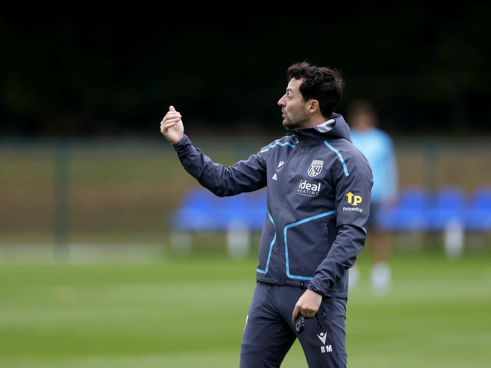 Ryan Mason delivering instructions to his players during a training session