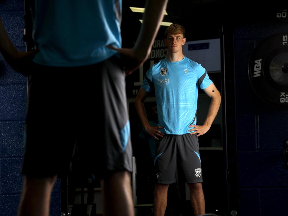 Toby Collyer stood looking at the mirror in the gym