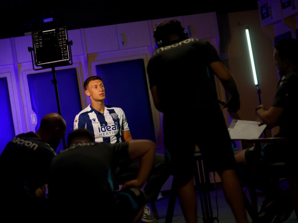 Krystian Bielik in a home shirt being interviewed by WBA TV