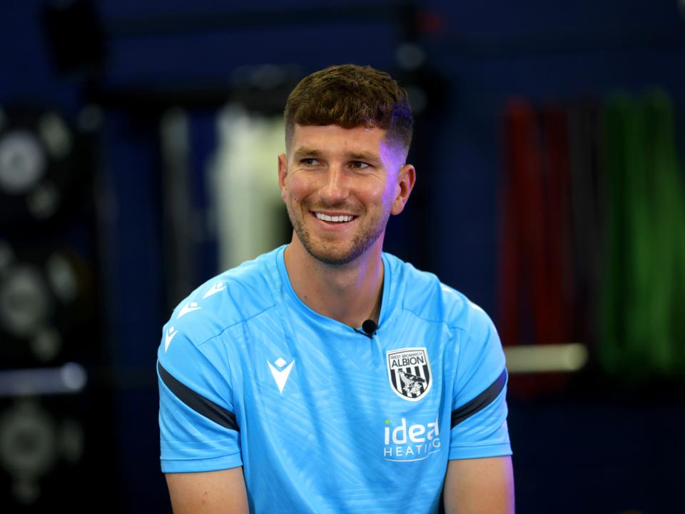 Chris Mepham smiling while sat in the gym