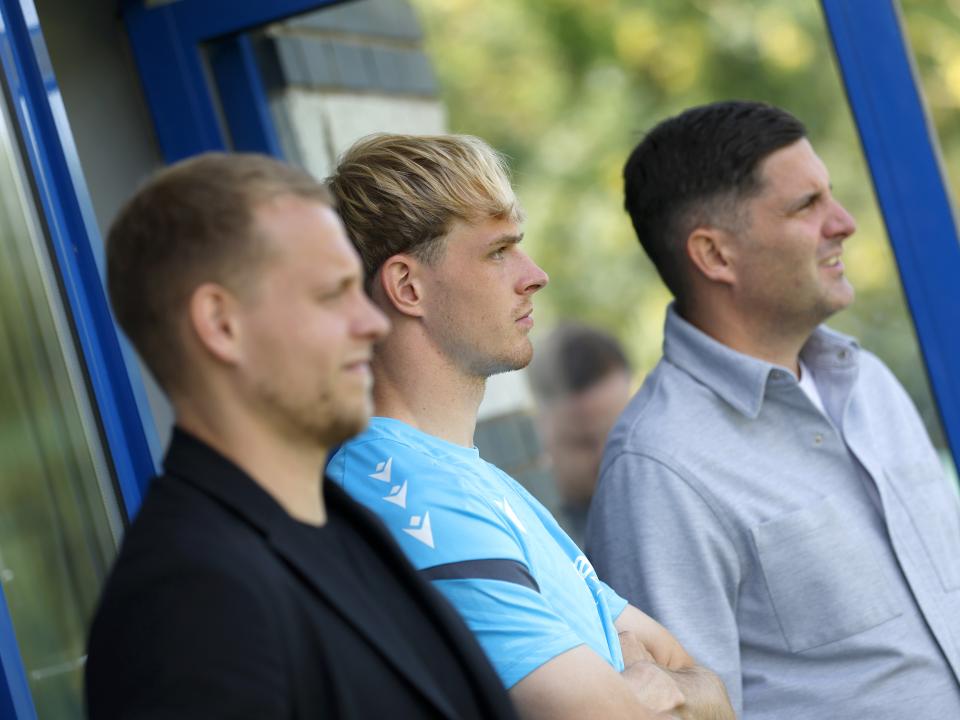 Toby Collyer watching training with his representatives 