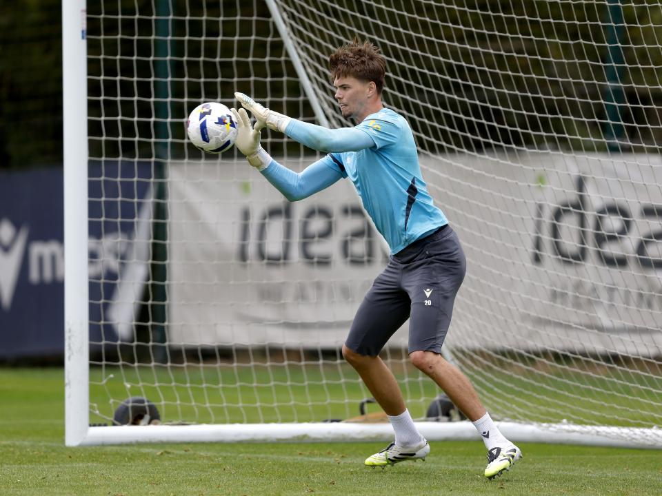 Josh Griffiths catching a ball during a training session