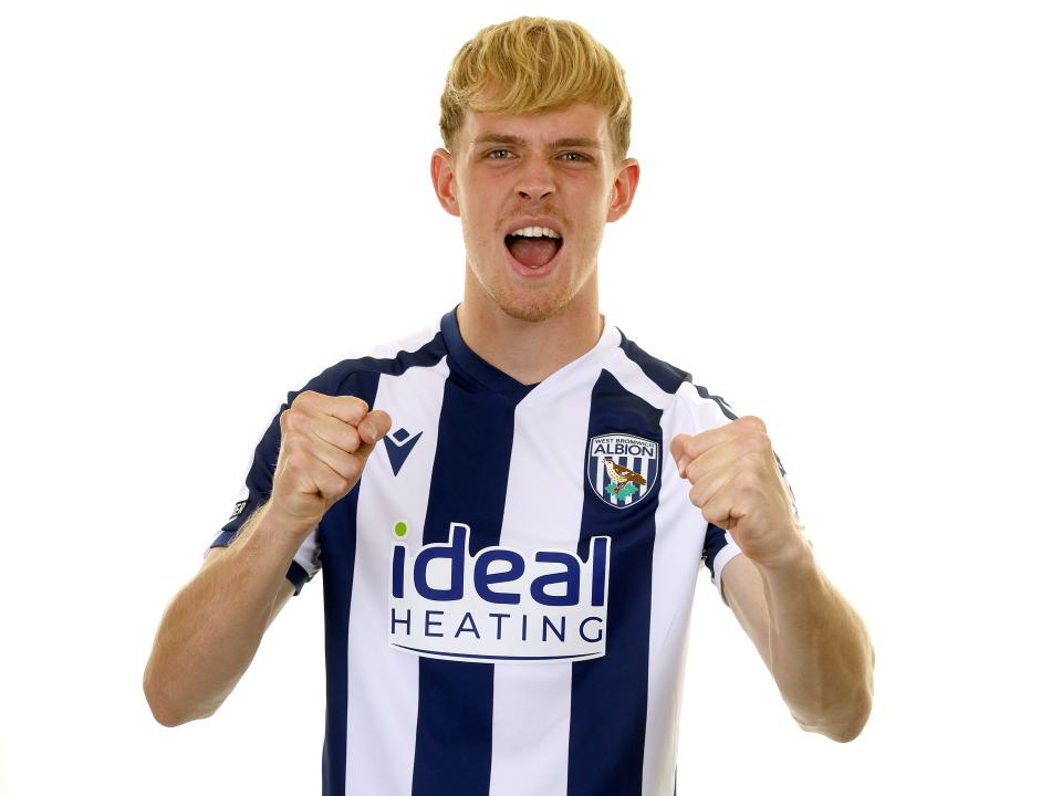 Toby Collyer celebrating towards the camera while in the home kit 