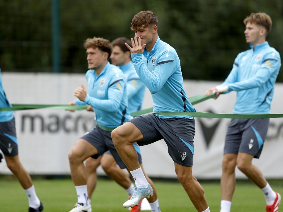 Several players warming up during a training session