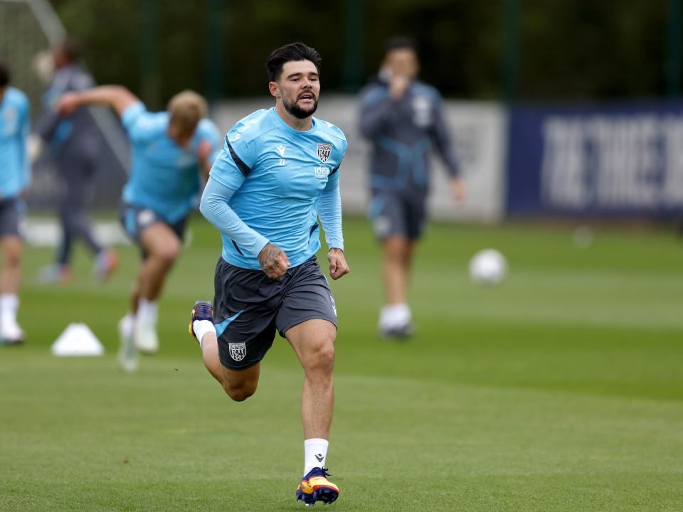 Alex Mowatt running forward during training 
