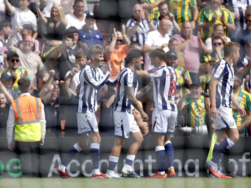 Isaac Price celebrates scoring his first goal at Wrexham with team-mates