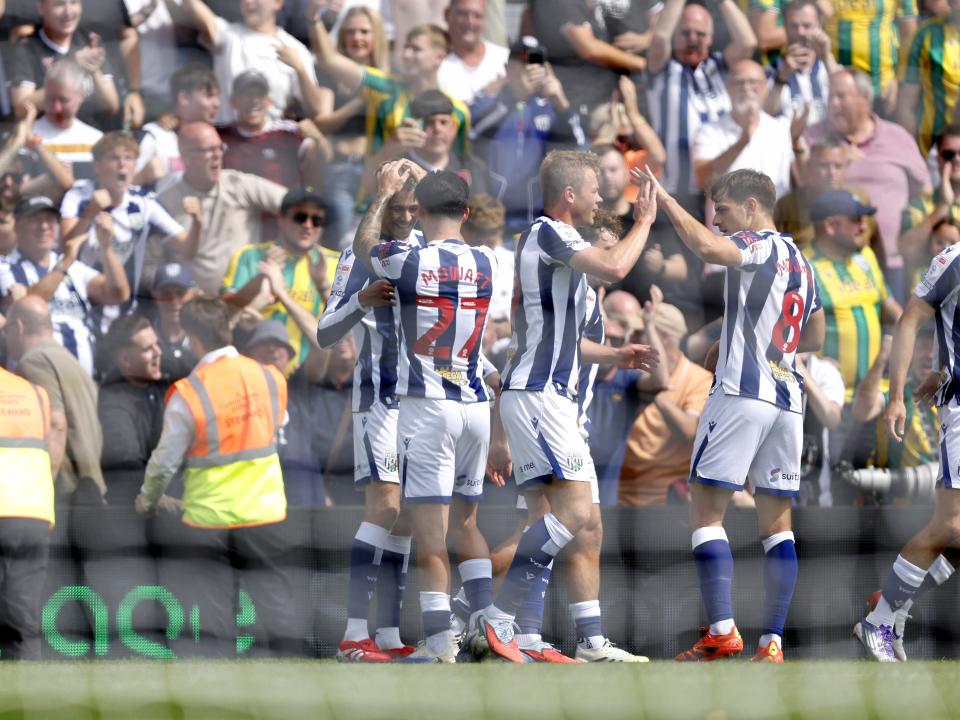 Isaac Price celebrates scoring his first goal at Wrexham with team-mates