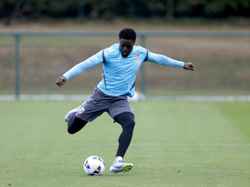 Josh Griffiths striking the ball during training 