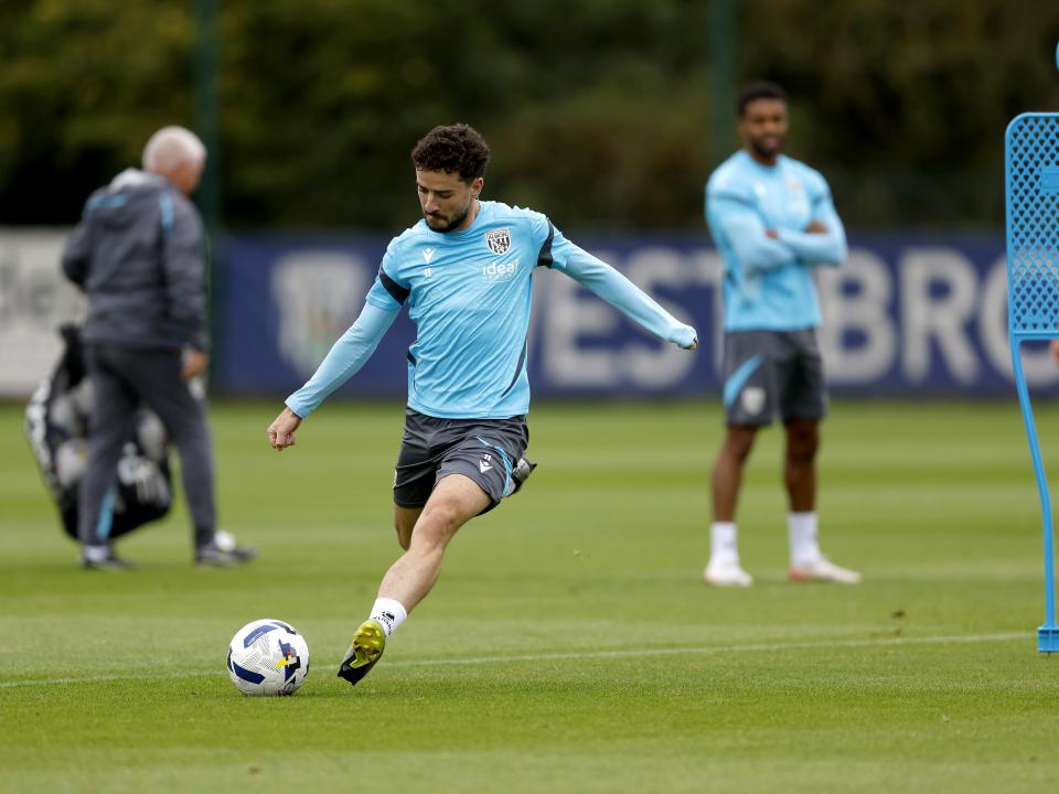 Mikey Johnston striking the ball during training 