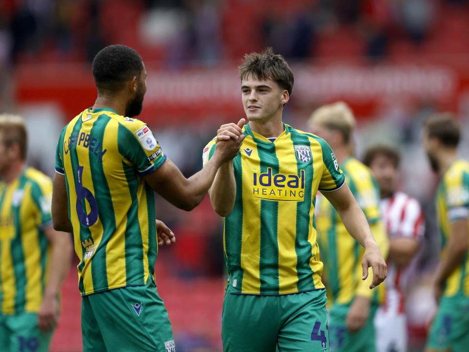 George Campbell and Alex Williams applauding WBA fans at Stoke