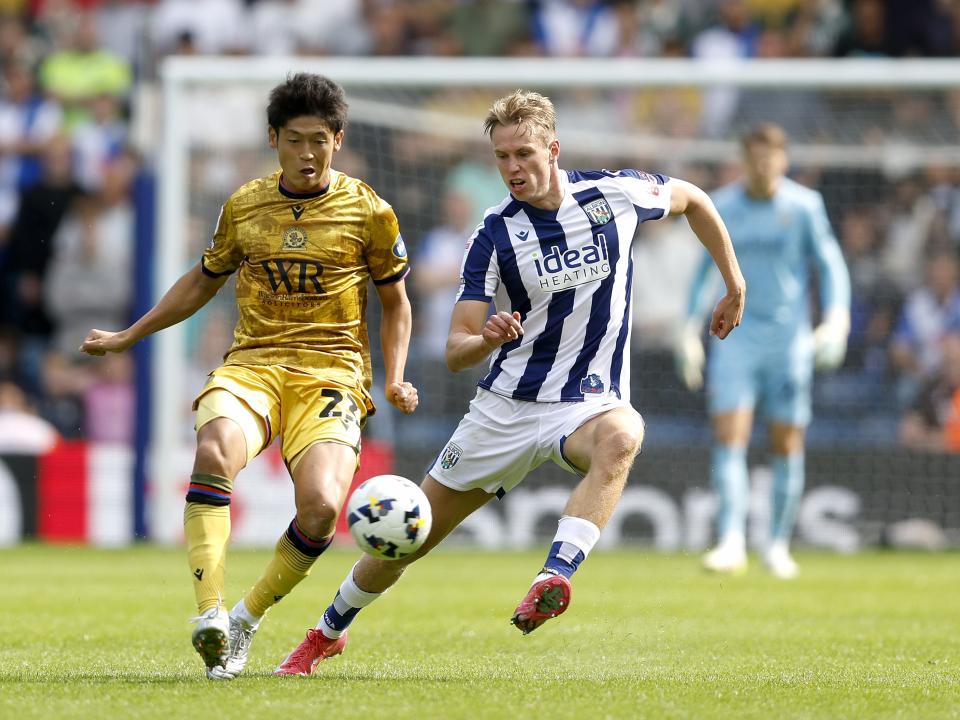Torbjørn Heggem fighting for the ball against a Blackburn player
