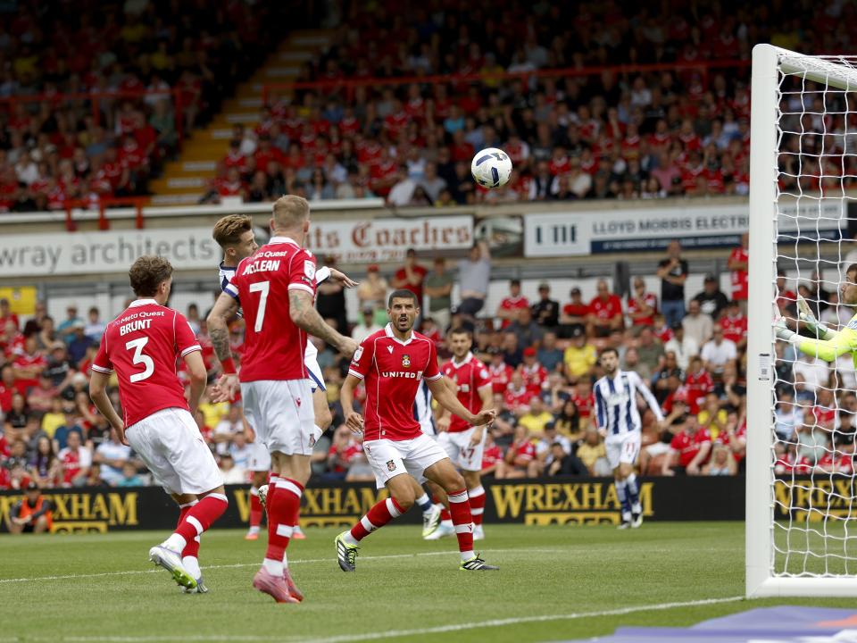 Isaac Price scoring a header against Wrexham 