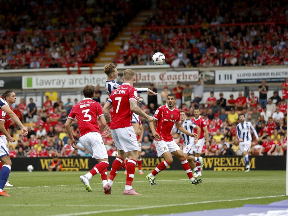 Isaac Price scoring a header against Wrexham 