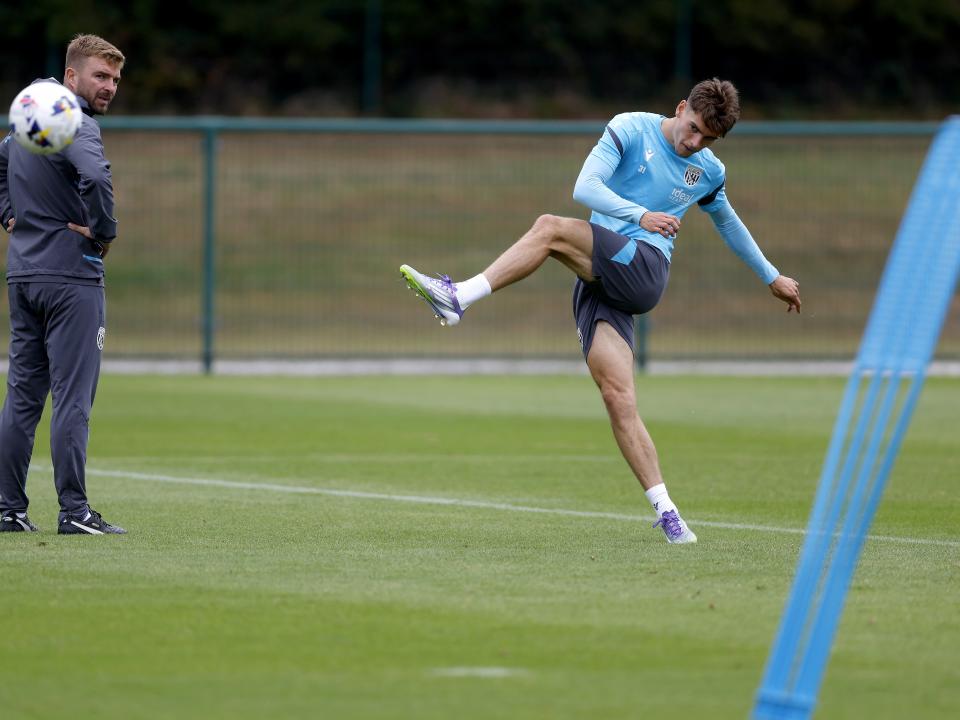 Tom Fellows striking the ball during training 