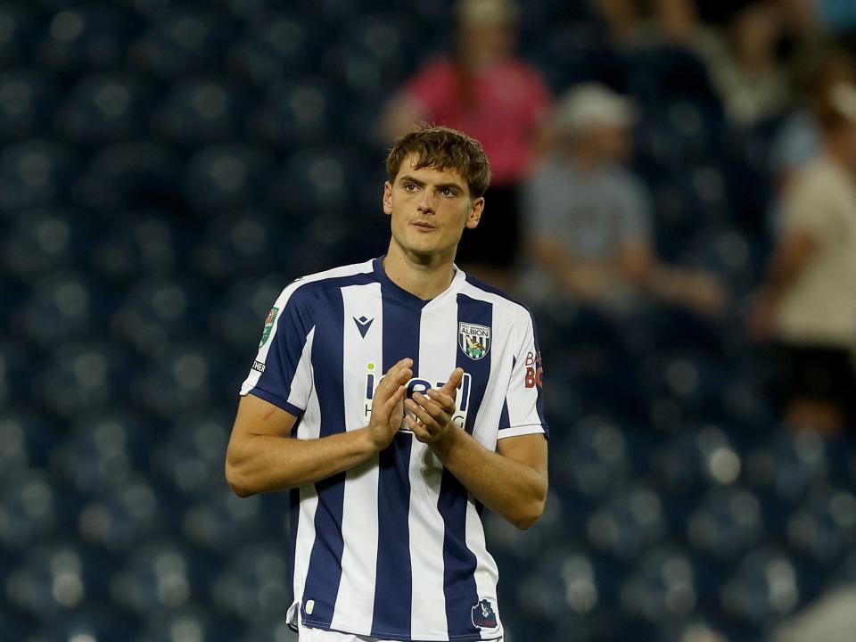Caleb Taylor in the home kit applauding WBA fans 