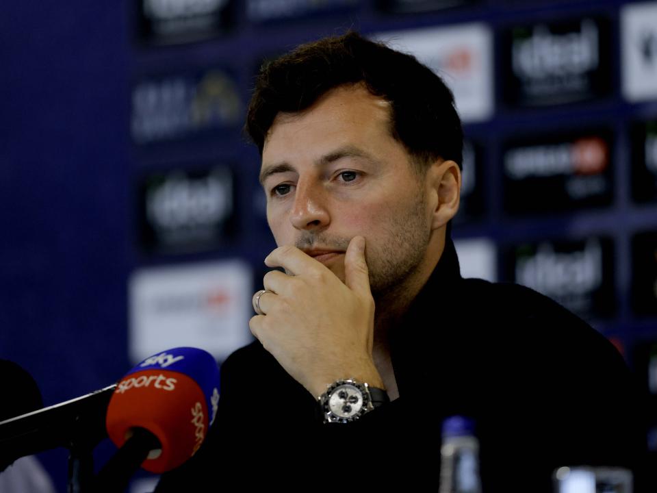 Ryan Mason with his hand on his chin during a press conference 